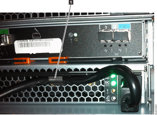 Storage enclosure power supply power input cable and retaining bracket